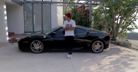Disgraced artist and accused art forger Christian Rosa with his Ferarri, a gift from a collector