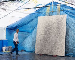 Lucien Smith with one of his fire hose paintings