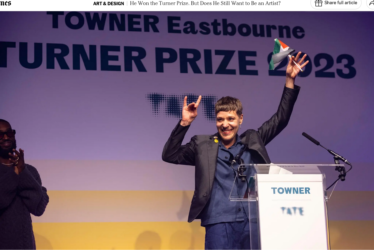 Darling held up a Palestinian flag at the announcement of the Turner Prize in December. Credit...Press Association, via Alamy