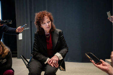 nan goldin speaking at a new briefing in Berlin- Lena Mucha for The New York Times