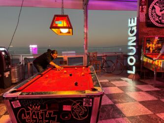 SCOPE founder Alexis Hubshman playing pool in the Better Together lounge